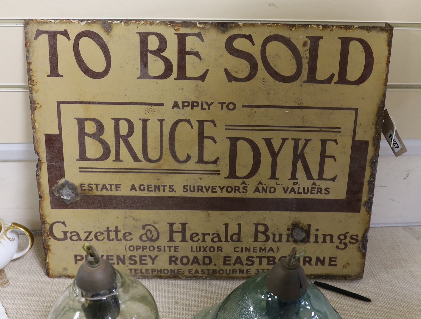 Eastbourne Interest - A ‘To be sold’ enamel sign - Bruce Dyke estate agents surveyors and valuers, 41cm high